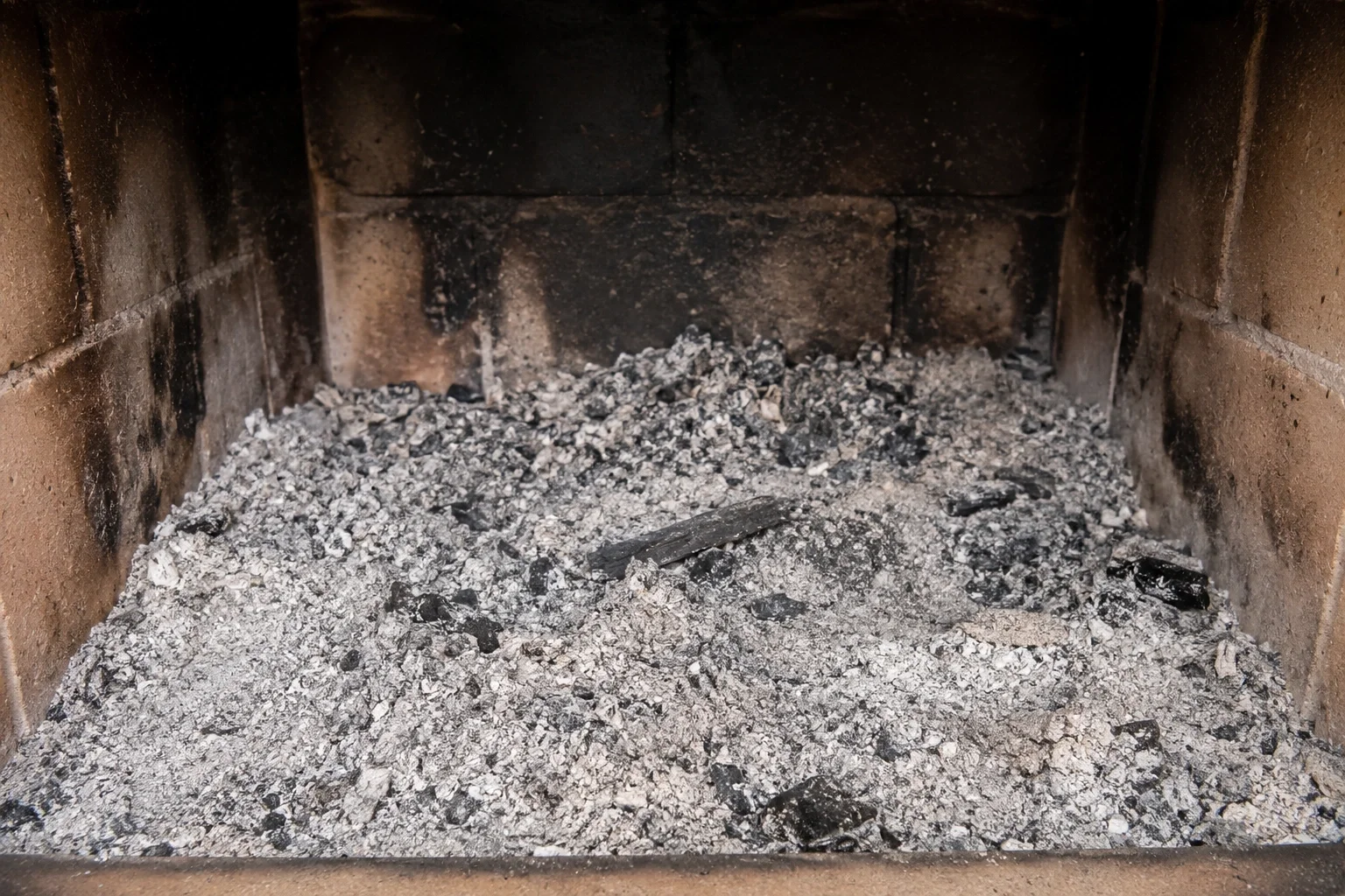 Fireplace ash accumulation before removal