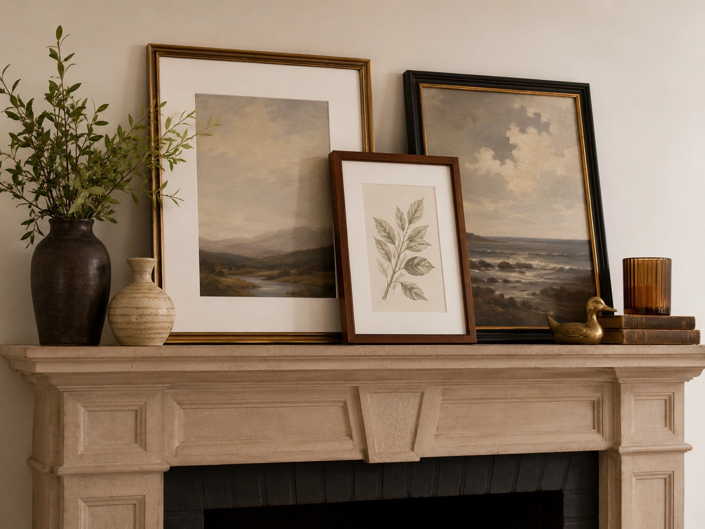 Fireplace mantel styled with artwork and accessories