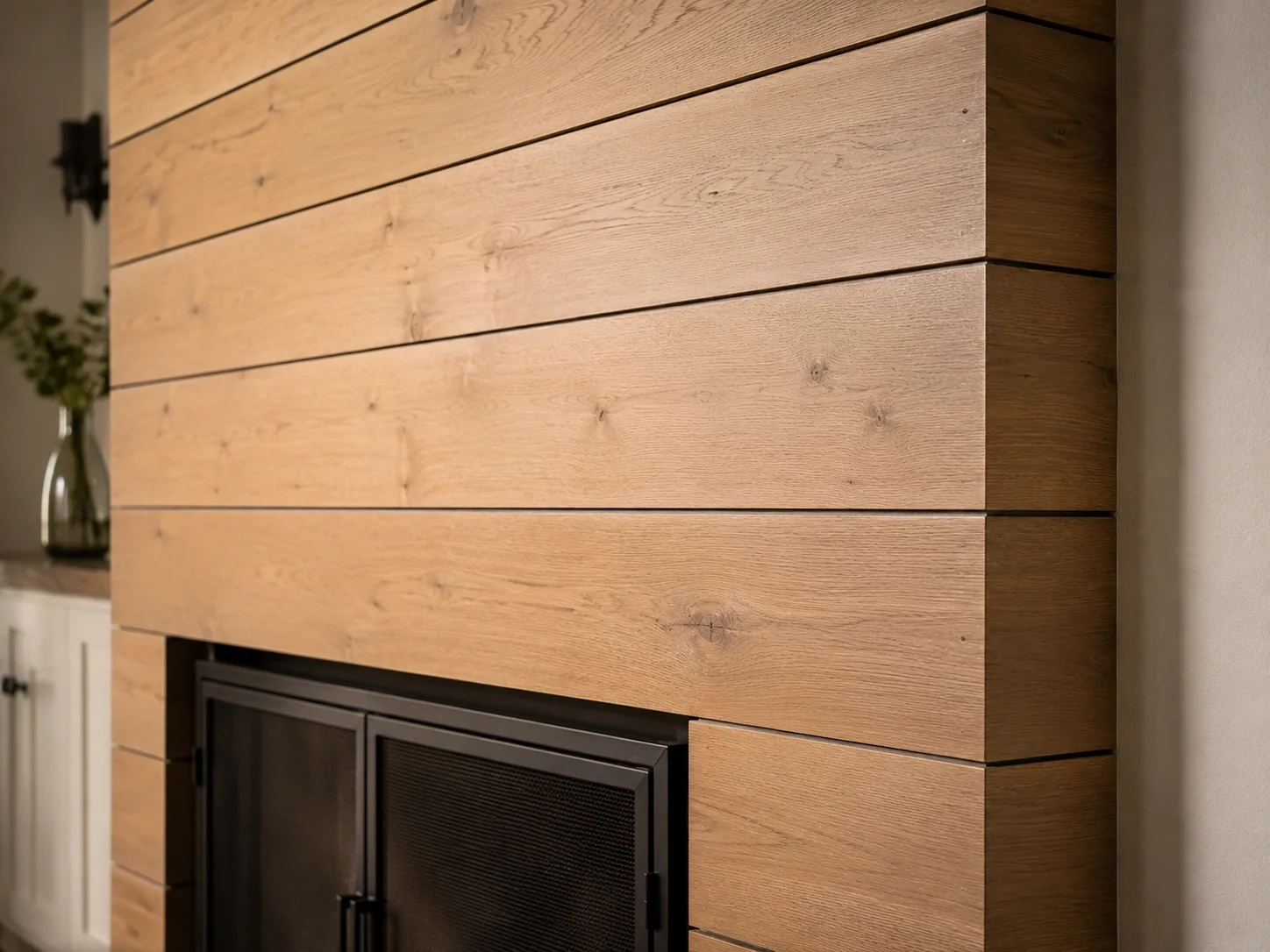 Completed DIY shiplap fireplace surround with clean lines and natural wood finish