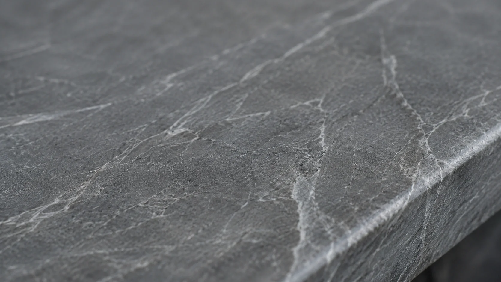 Close-up showing soapstone's smooth, dense texture with subtle veining